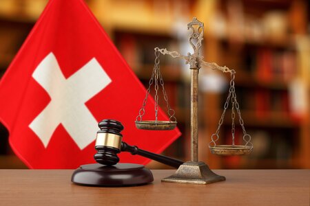Gavel And Scales Of Justice and National flag of Switzerland